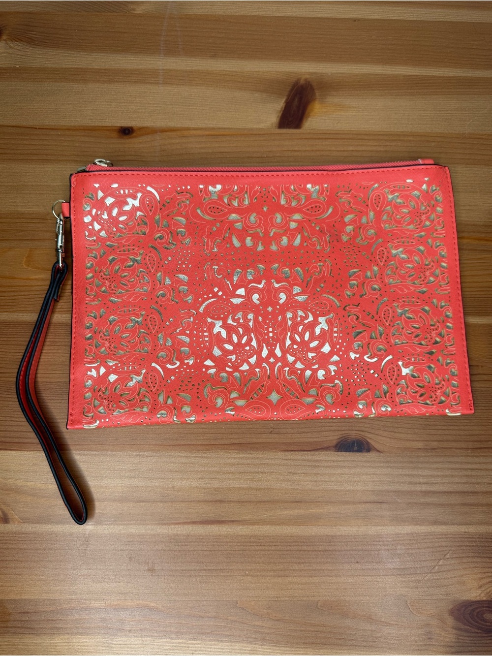 Call It Spring - orange lazer cut wristlet